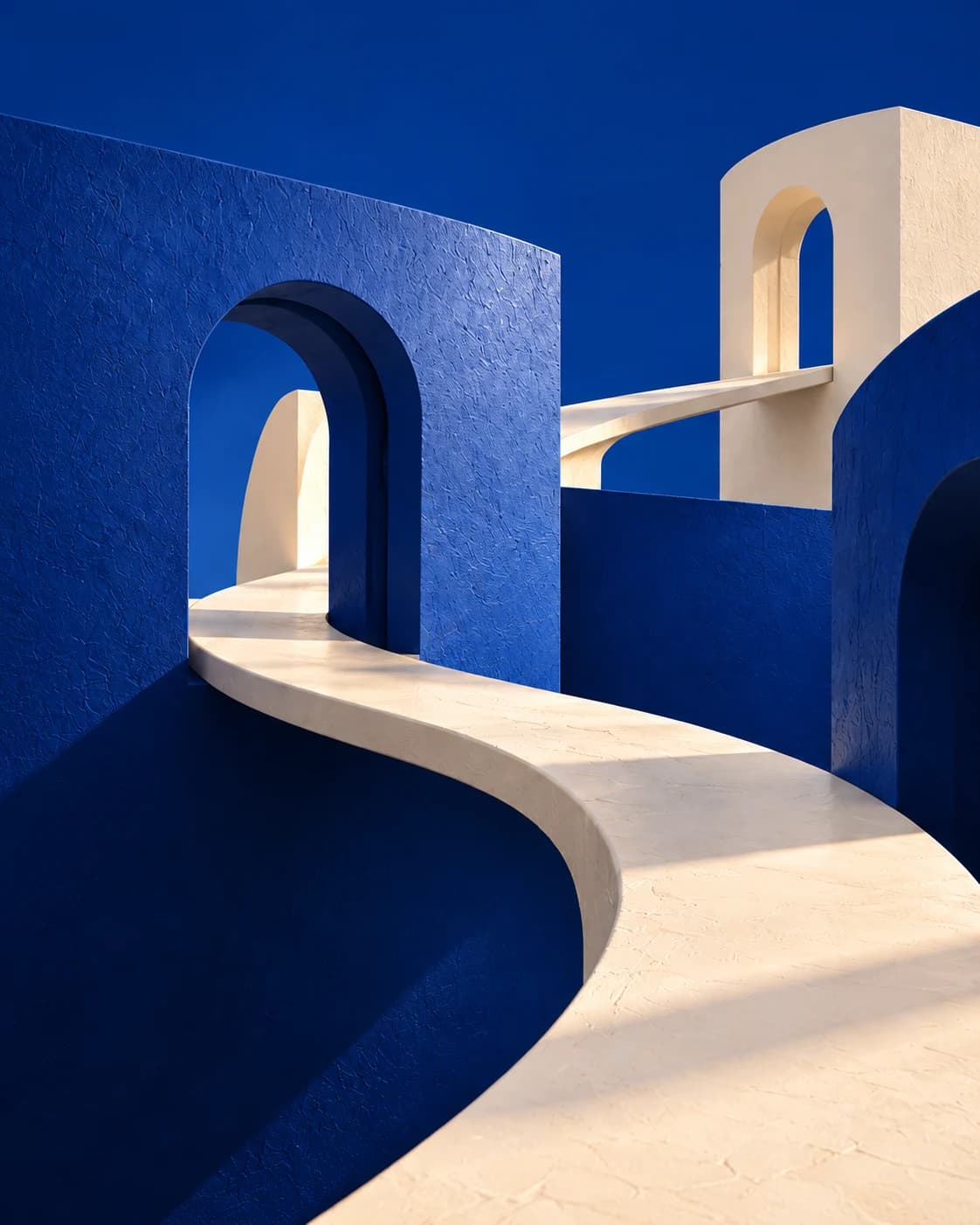 Sunlit blue arches joined by a curving white walkway, the KullGrid brand image.